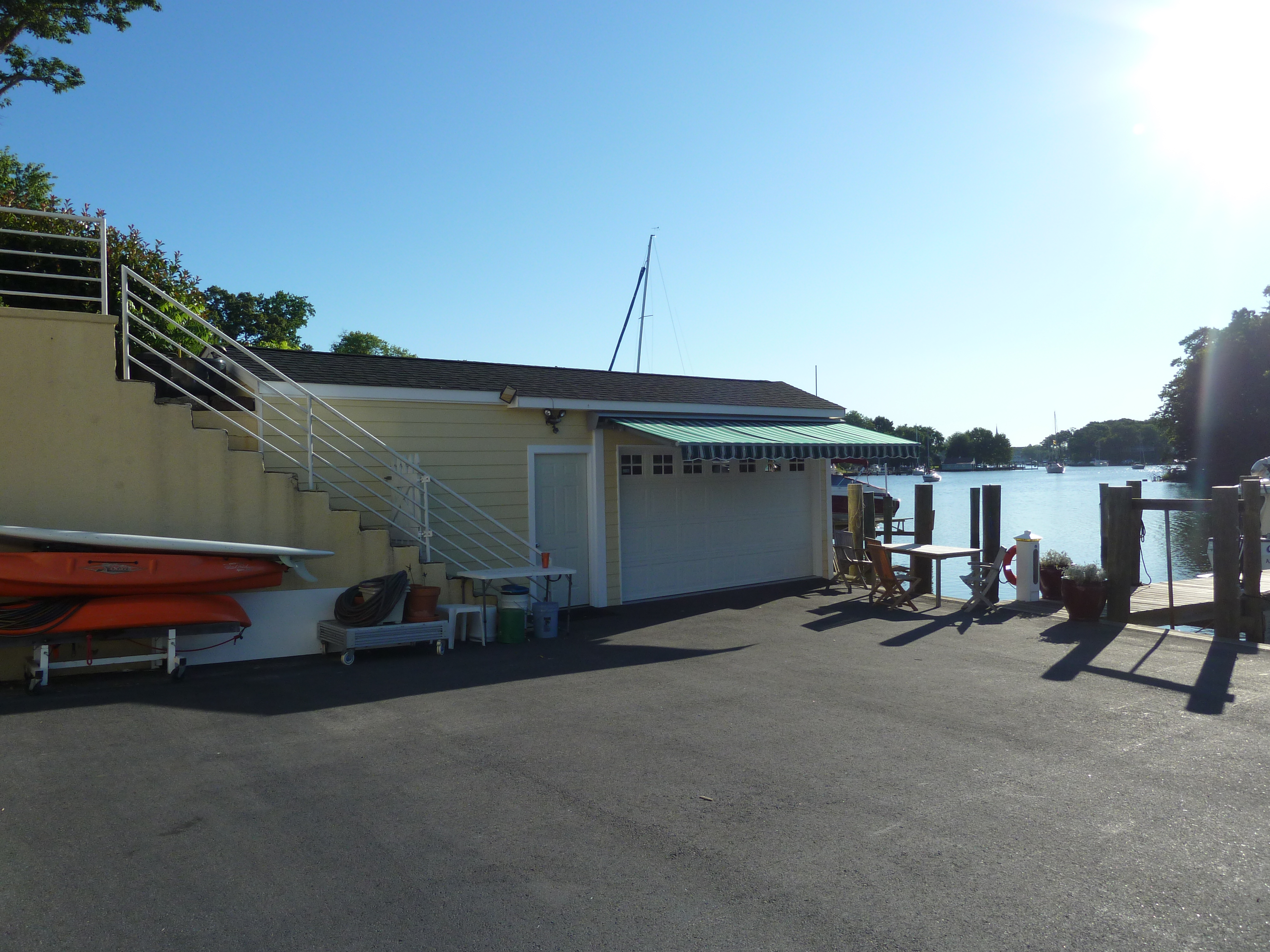 Waterfront marina building, dock, and moored boats